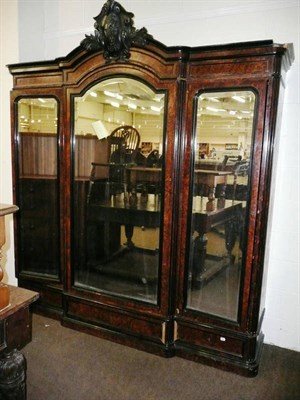 Lot 634 - 19th century Continental walnut triple wardrobe