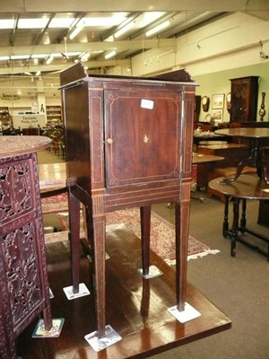 Lot 648 - A Georgian mahogany pot cupboard