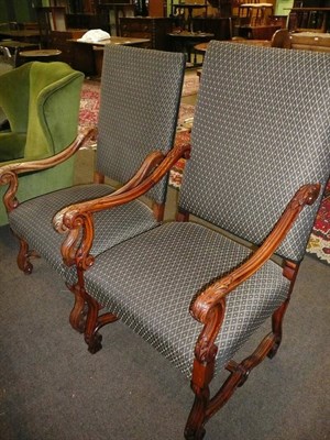 Lot 677 - A pair of walnut framed arm chairs in the 18 century style