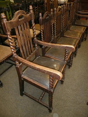 Lot 680 - A set of six oak rail back dinning chairs including two carvers