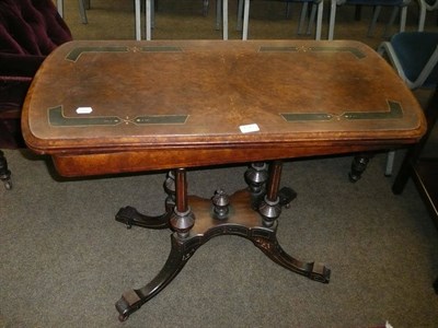 Lot 695 - Victorian walnut and ebonised fold-over card table