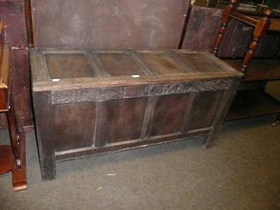 Lot 711 - A 17th century oak four-panelled linen chest