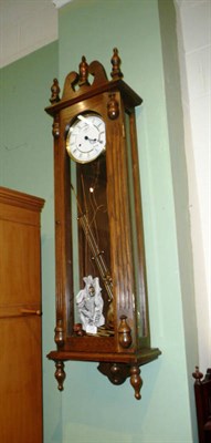 Lot 721 - A reproduction oak Vienna style wall clock