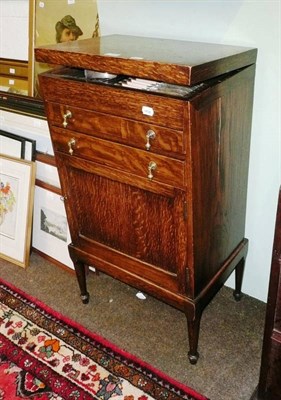 Lot 742 - Oak cabinet canteen of silver plated Old English pattern flatware, white linen etc