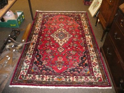 Lot 745 - Red ground wool Eastern patterned rug