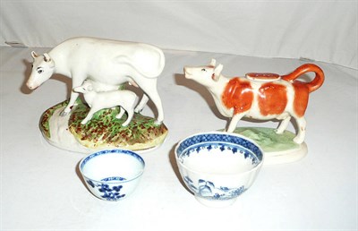 Lot 1 - Staffordshire cow group and a cow creamer and two tea bowls