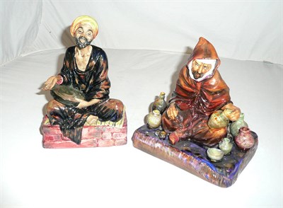 Lot 40 - Two Royal Doulton figures 'Mendicant' HN1365 and 'The Potter' HN1493