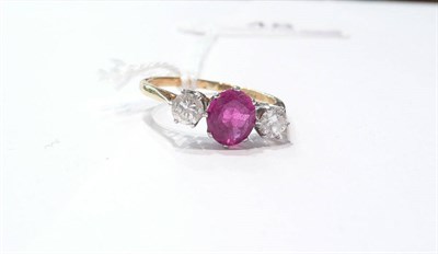 Lot 48 - Diamond and ruby three stone ring