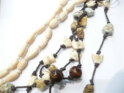 Lot 50 - A Japanese bone, ivory, ceramic and wood necklace and an ivory necklace