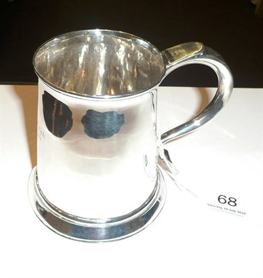 Lot 68 - A Georgian later engraved silver tankard