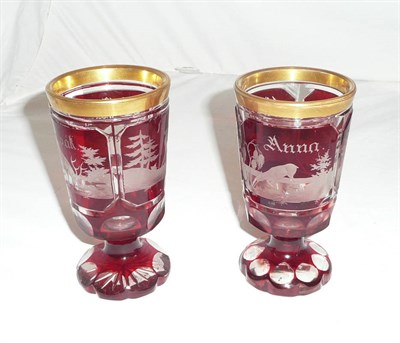 Lot 84 - A pair of Bohemian ruby flash glass marriage goblets, 1854