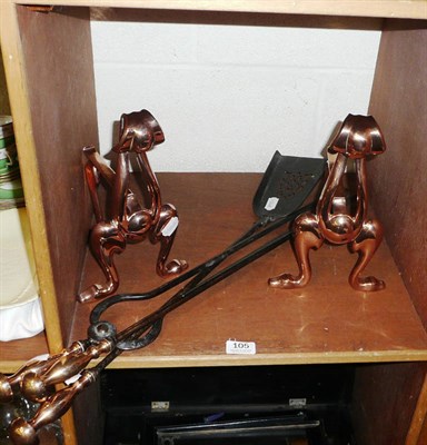 Lot 105 - Set of three fire irons and a pair of copper fire dogs