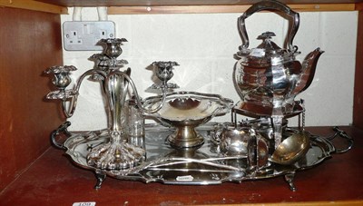 Lot 109 - Quantity of silver plates, a tray, spirit kettle, etc on one shelf