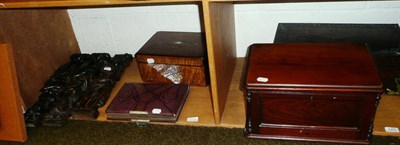 Lot 121 - Three oak figural carvings and a pair of oak carvings and assorted boxes on two shelves