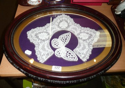 Lot 122 - Framed lace collars, a parcel of lace and a Chinese embroidered panel