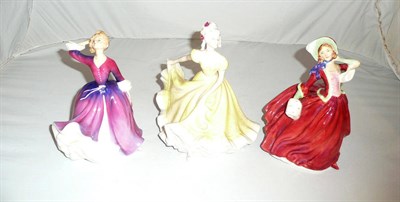 Lot 154 - Three Royal Doulton china figures - Autumn Breezes HN1934, Melissa HN2467 and Ninette HN2379