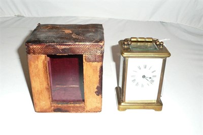 Lot 169 - A brass carriage timepiece and fitted case