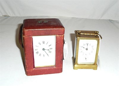 Lot 170 - A carriage clock timepiece in a fitted case and another carriage timepiece with alarm