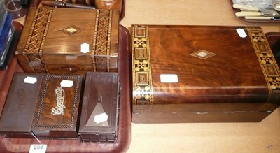 Lot 204 - Parquetry inlaid walnut stationary box, another and an oak cigarette box and two Bakelite examples