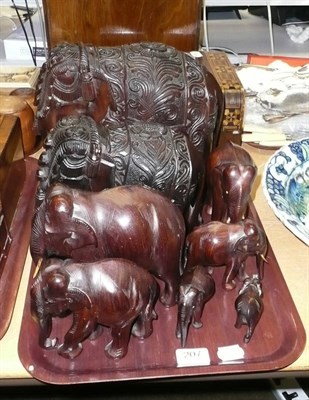 Lot 207 - A tray of assorted carved elephant ornaments and an elephant hat and coat rack