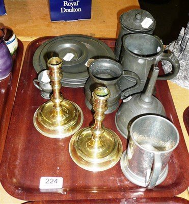 Lot 224 - A quantity of pewter and a pair of brass candlesticks