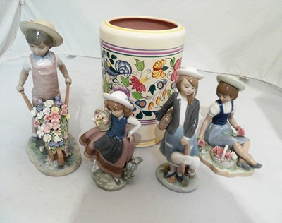 Lot 230 - Four Lladro figures and a Poole vase