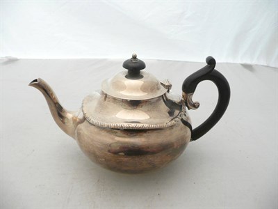 Lot 238 - A silver small compressed teapot