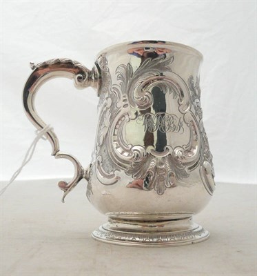 Lot 242 - A George III silver mug, later decorated