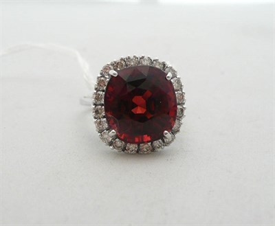 Lot 246 - A 14ct white gold garnet and diamond cluster ring