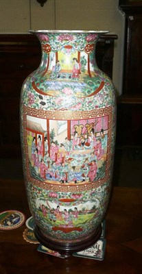 Lot 289 - A Chinese Canton decorated ovoid porcelain vase, decorated with numerous court figures, with wooden