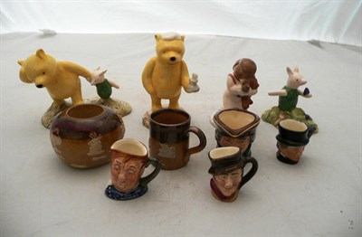 Lot 298 - Four Royal Doulton Winnie The Pooh figures, a Doulton miniature stoneware mug, candle holder...