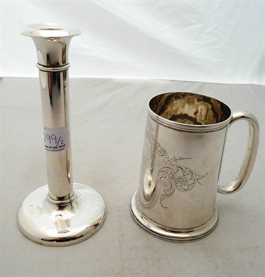 Lot 299 - A Victorian silver mug and a candlestick