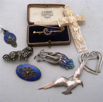 Lot 301 - A seed pearl set crescent brooch, a diamond tie pin, a mother-of-pearl cross, an 'IONA' double...