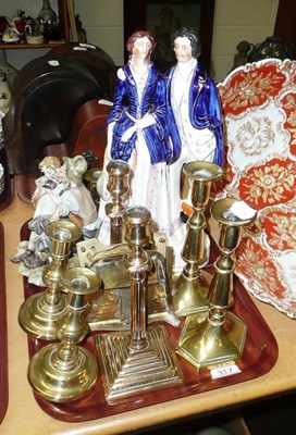 Lot 317 - A tray of brass candlesticks, Staffordshire figure etc