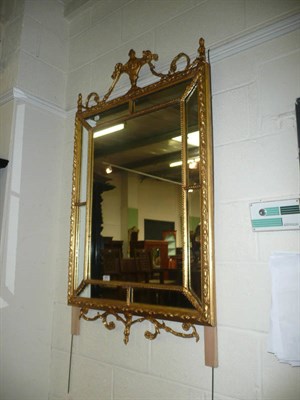 Lot 364 - An Adams-style urn border mirror 53 inches high x 32 inches wide