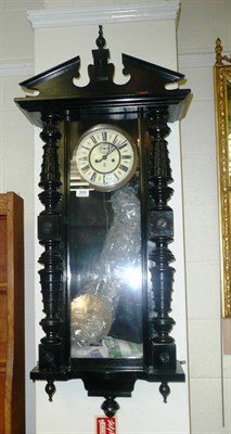 Lot 366 - A 19th century ebonised wall clock by Gustav Becker with pendulum and two weights