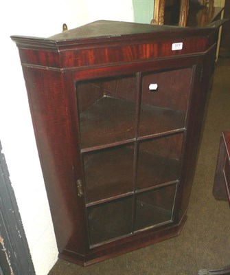 Lot 377 - A mahogany corner cupboard