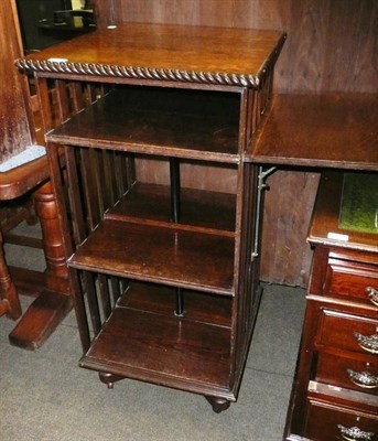 Lot 388 - An oak revolving book stand and bookcase