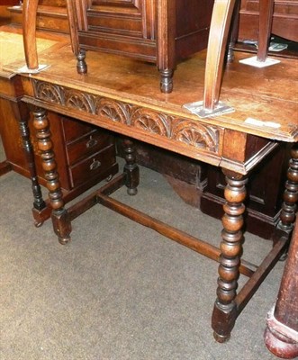 Lot 393 - An 18th century style oak single draw side table