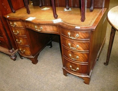 Lot 398 - A reproduction mahogany serpentine front desk