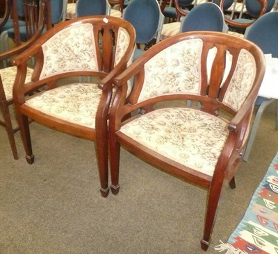 Lot 440 - A pair of early 20th century mahogany tub shaped arm chairs