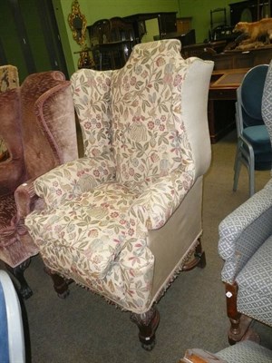 Lot 453 - An early 18th century-style walnut-framed wing armchair