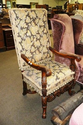 Lot 455 - A Carolean-style carved walnut open armchair with needlework upholstery