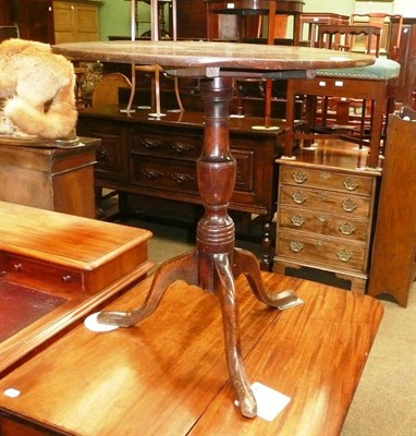 Lot 457 - A George III oak and elm tripod table