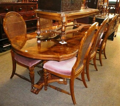 Lot 471 - Colonial style dining table, six cane back dining chairs, coffee table and display cabinet