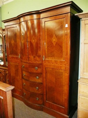 Lot 489 - Edwardian inlaid bow front combination wardrobe