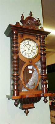 Lot 499 - A walnut cased wall clock by Gustav Becker with key and pendulum