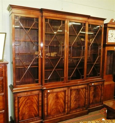 Lot 502 - A reproduction mahogany breakfront bookcase