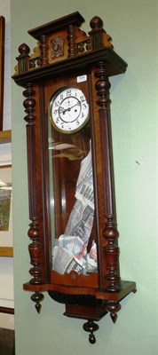 Lot 504 - A walnut cased Vienna style wall clock by Gustav Becker with key, pendulum and weights