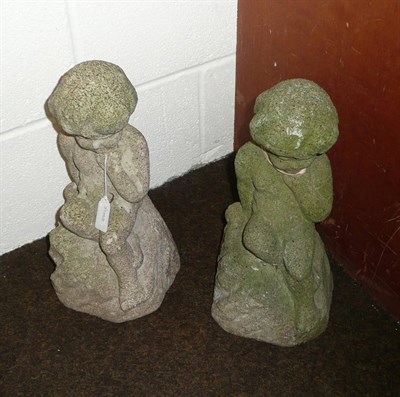 Lot 509 - A pair of composition stone figures